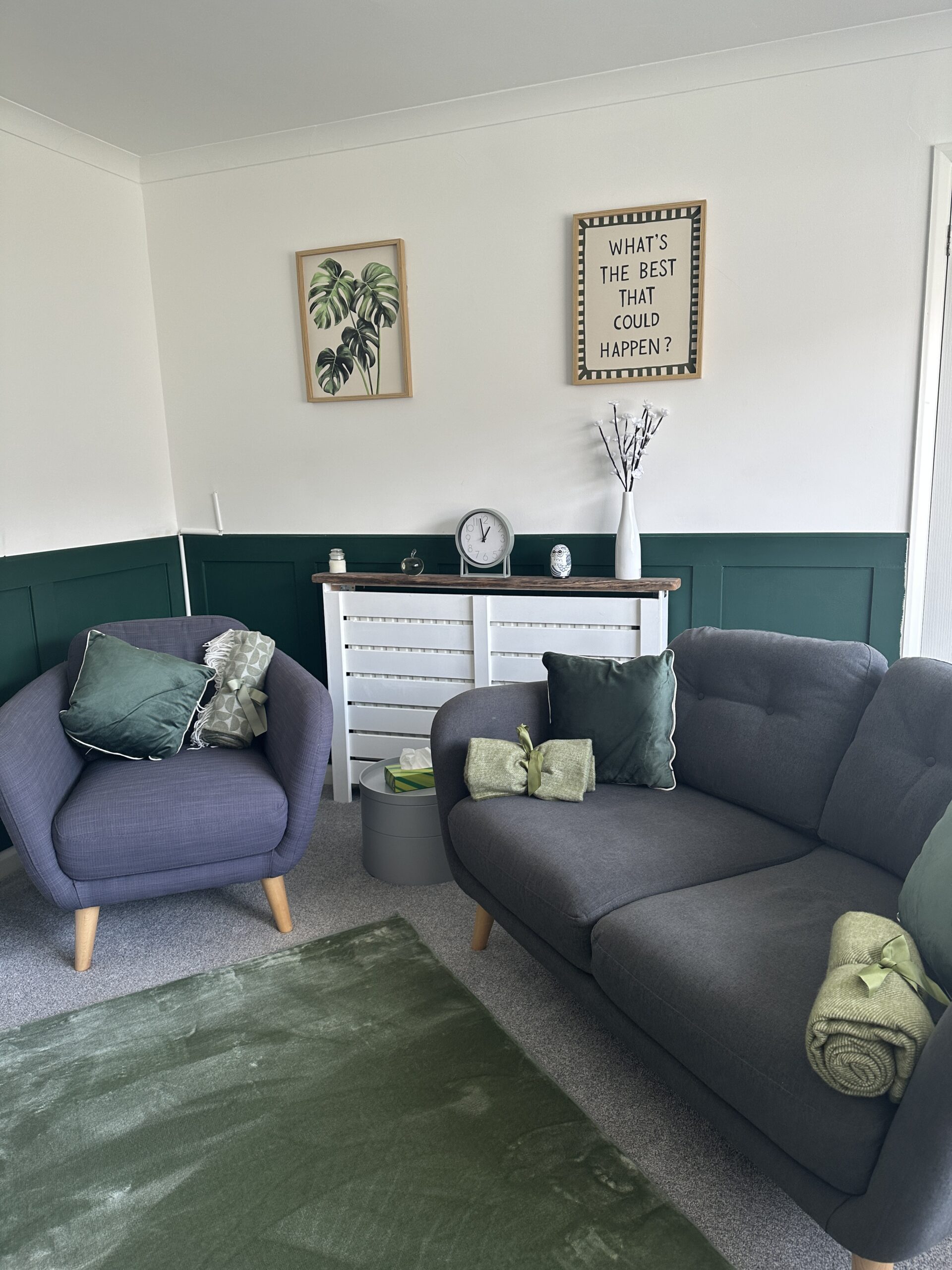 A calm, welcoming counselling room with comfortable seating, green accents, and soft natural light. This space is used for in‑person therapy sessions in Plymouth.